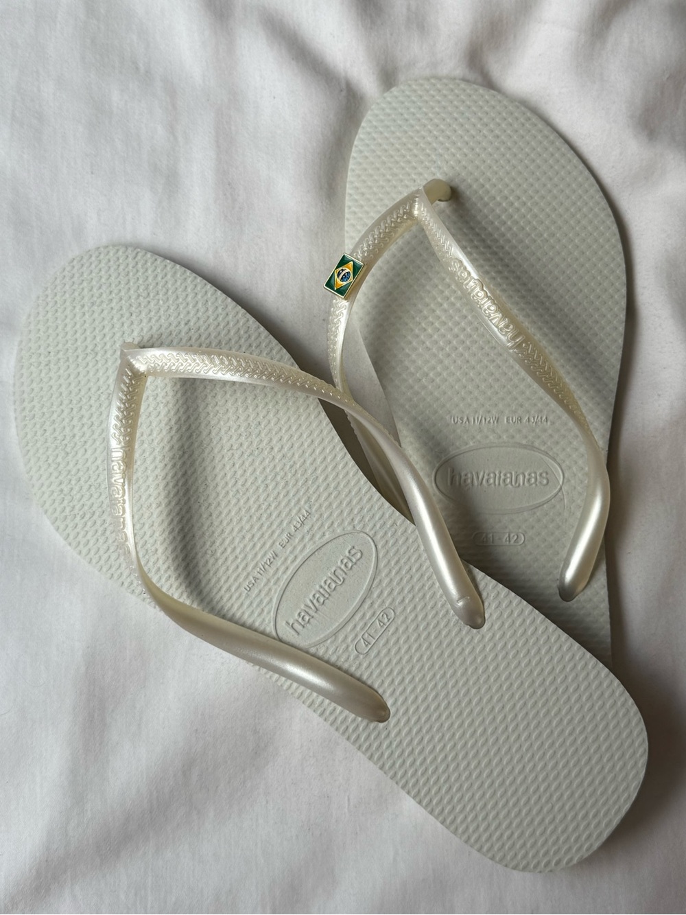 Authentic white Havaiana’s with pearl white strap and Brazil charm!  (BRAND NEW)